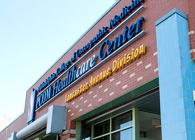 Front doors of the PCOM Healthcare Center on Lancaster Avenue