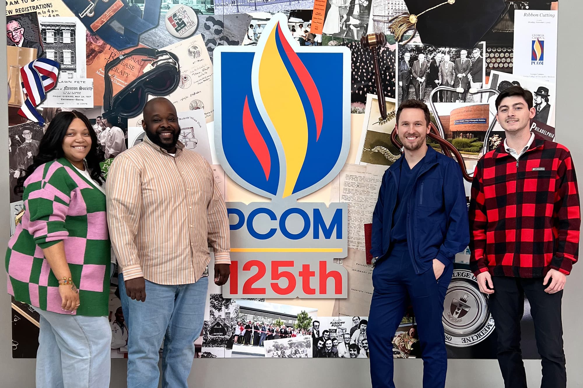 Four grad students smiling on front of the PCOM 125th anniversary collage