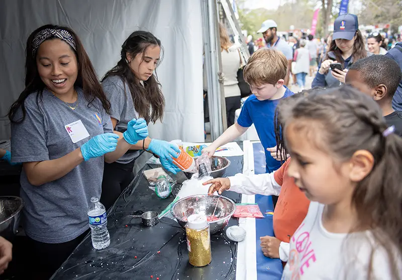 PCOM Georgia students teach children about the components of blood through interactive slime making