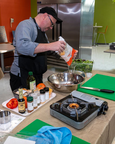 A healthy meal is prepared in the DO 190E Culinary Medicine course