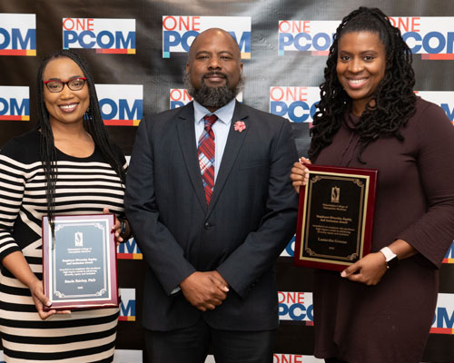 Darnae Parks, MSLD, presents plaques to Stacie Fairley, PhD, and Lastarsha Greene