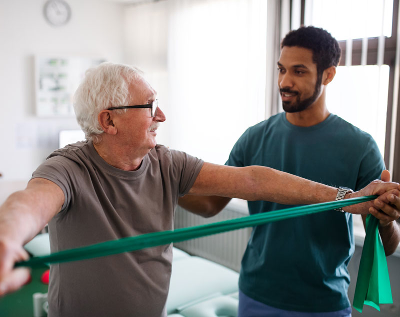 Physical Therapist works with patient