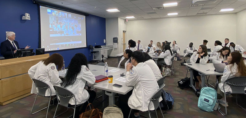 PCOM Georgia pharmacy students listen to a presentation during the Day at the Dome event