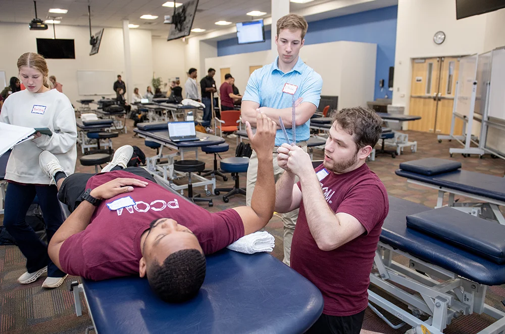 DPT students demonstrate techniques for aspiring PTs during PCOM Georgia's “A Day in the Life of a PT Student” event