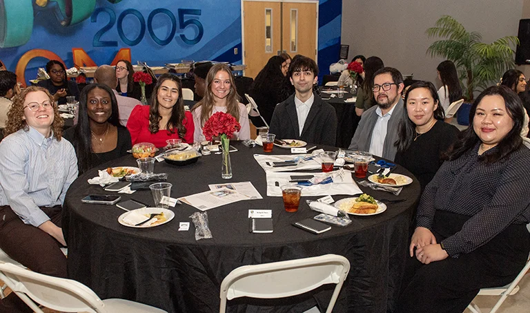 PharmD students sit together at dinner table