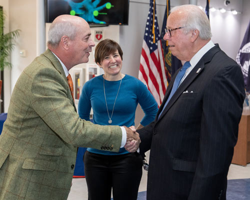 Dr. Gimpel shaking hands with David McCleskey