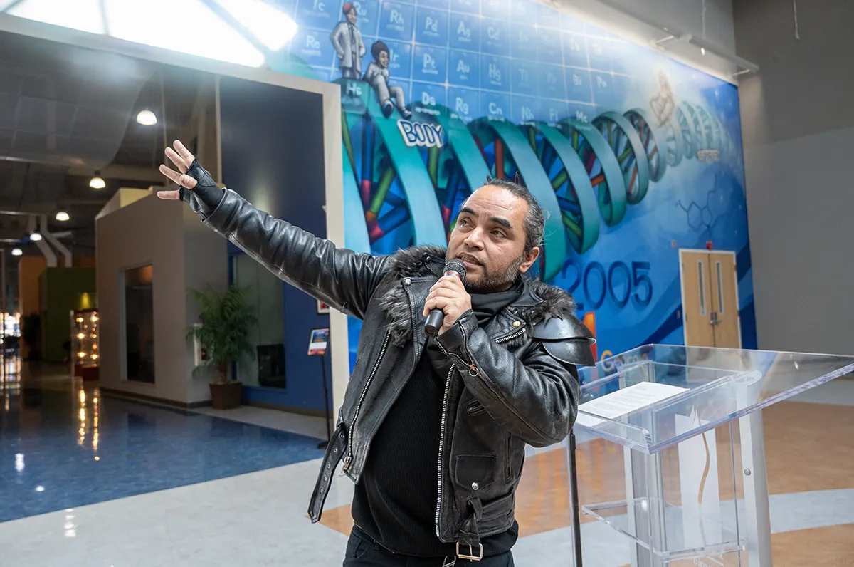 Atlanta artist Mr. Totem presents his completed DNA art wall project to PCOM Georgia
