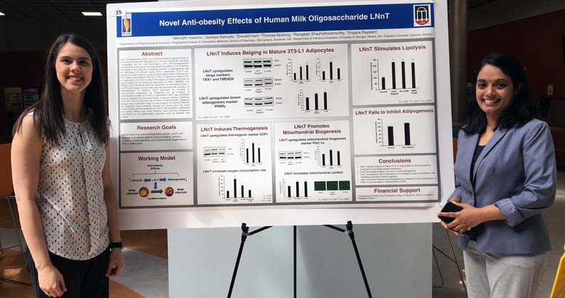 Meridith Hawkins, MS/Biomed ’18, pictured left, presents her research poster at GA-PCOM's annual Research Day