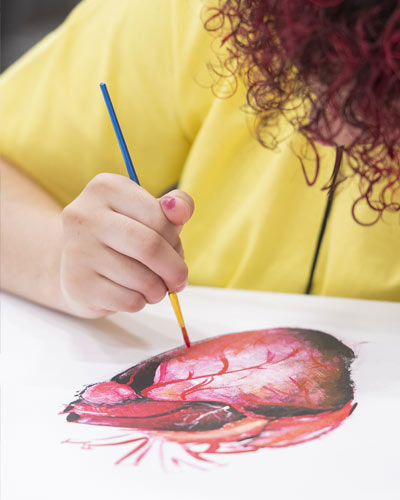 A participant of the Opportunities Academy paints a picture of the human heart