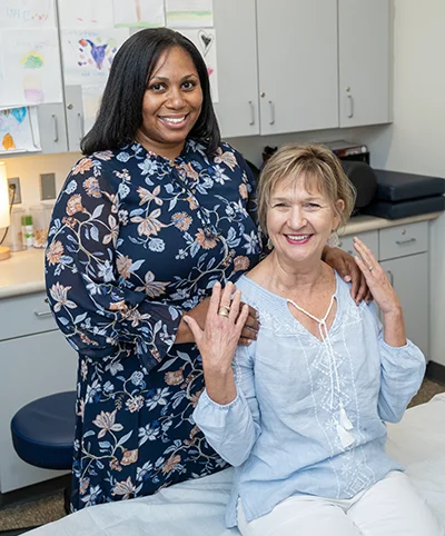 Dr. Vega and patient Frances Jackson pose for a photo
