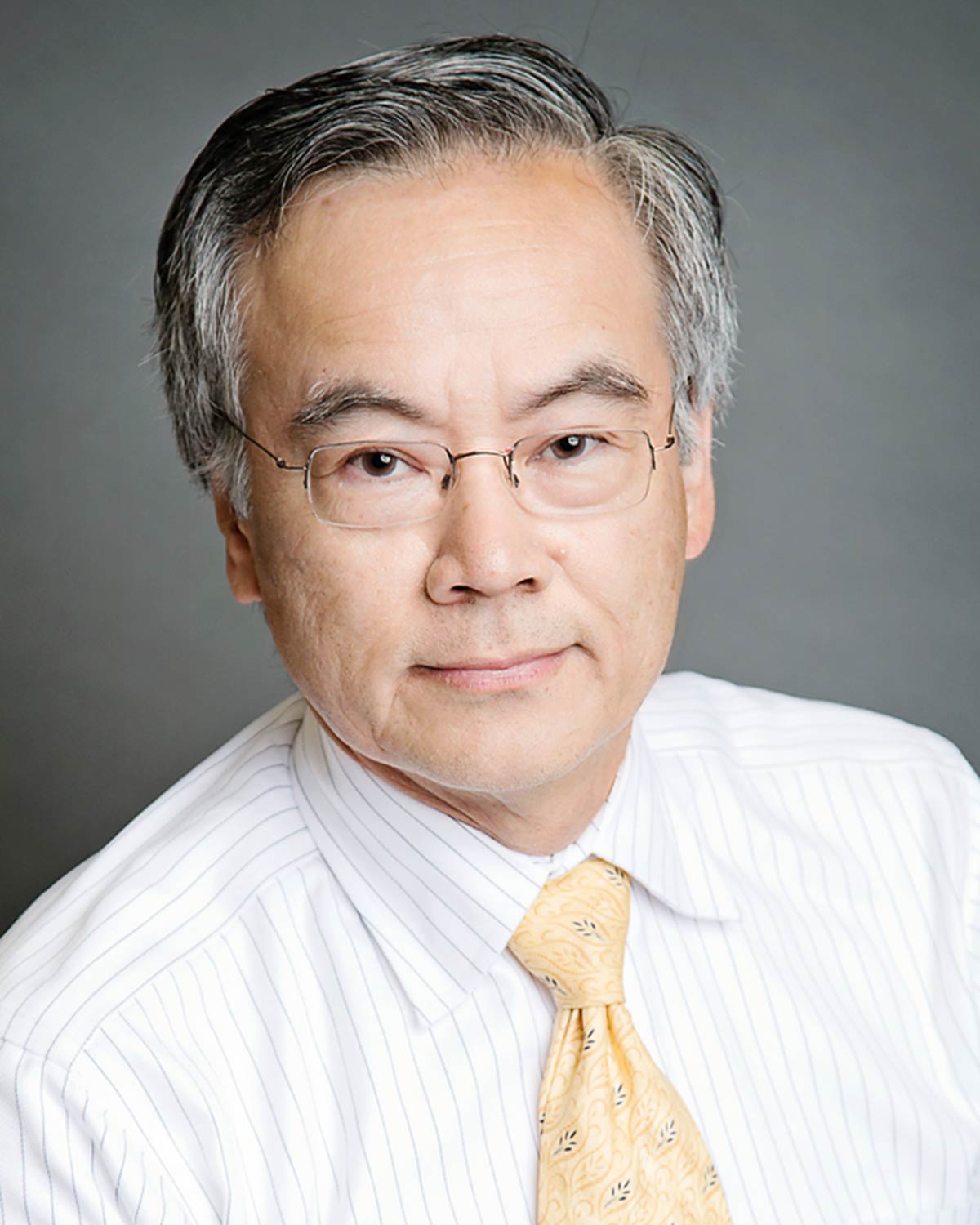 Professional headshot photograph of Dr. Ben Abraham