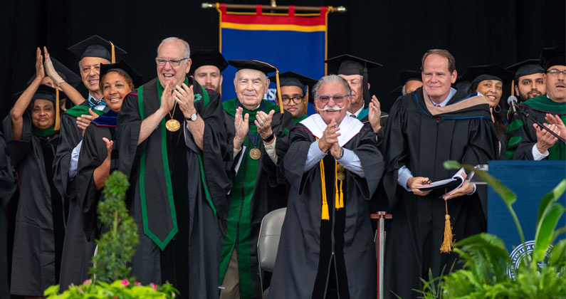 PCOM Georgia administration, faculty and staff celebrate the 2022 graduates on stage