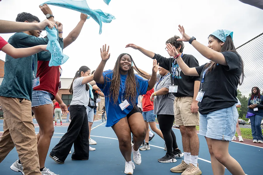 High schoolers laugh and cheer during a team-building activity at PCOM Georgia's Opportunities Academy summer STEM camp