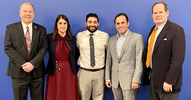 Vash Patel (DO ’20) and Yassmin Shariff (DO ’20) pose with PCOM Georgia faculty and staff