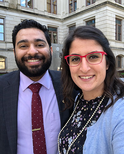 Vash Patel (DO ’20) and Yassmin Shariff (DO ’20) smile in front of the Georgia state Capitol building