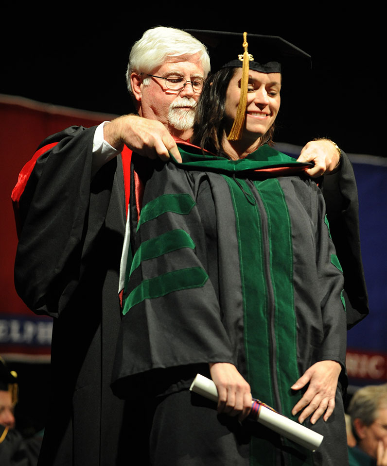 PCOM Georgia's Dr. Himmelbaum receiving graduation hood during PCOM Georgia's DO commencement ceremony.