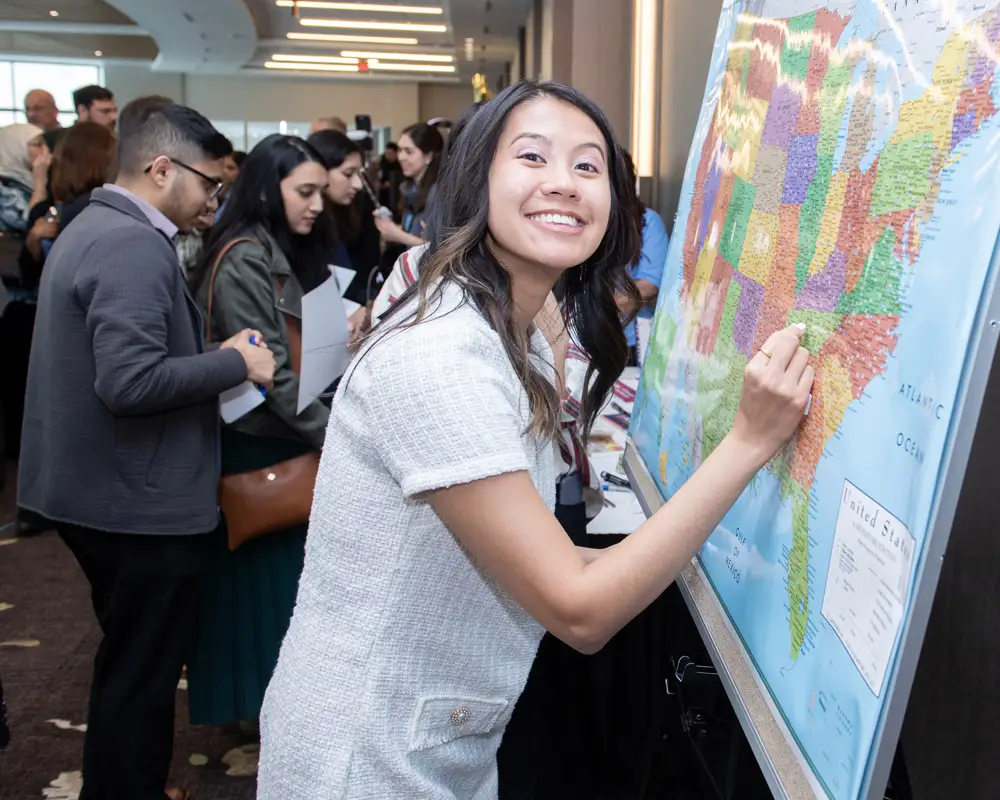 A PCOM Georgia DO student marks the location of her residency placement on a map