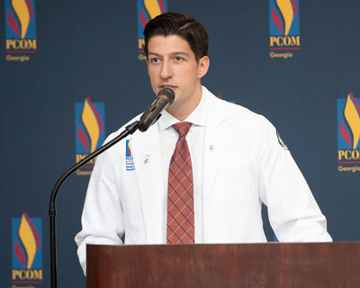 A PCOM Georgia student speaks at the memorial service