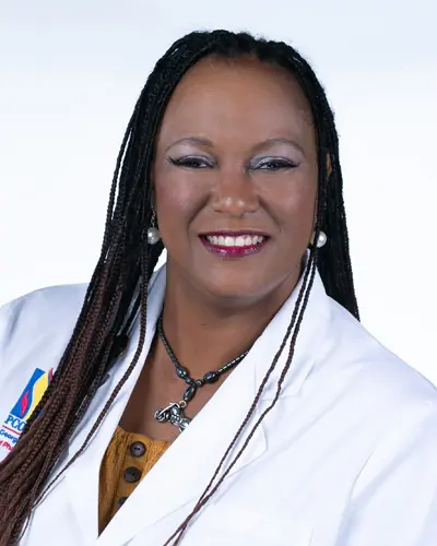 Professional headshot photograph of PCOM Georgia pharmacy student Makeda Lovelace (PharmD '25) in her student physician white coat