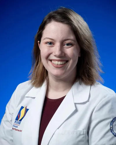 Professional headshot photo of PCOM Georgia PharmD student Joanna Donaldson wearing her student physician white coat