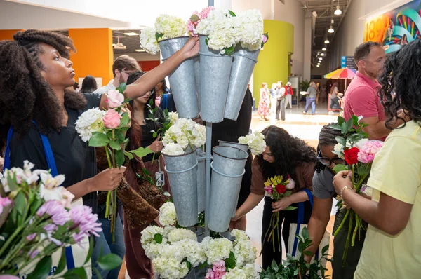 PCOM Georgia students gather flowers at the DIY flower "bloom bar"