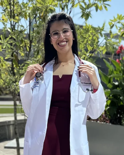 Sara Abdelmalak wearing a white coat on the PCOM Georgia campus