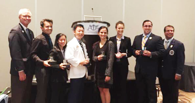 PCOM Georgia medical students smile and pose with their awards