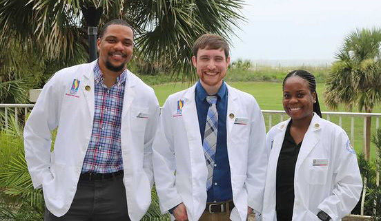 PCOM Georgia pharmacy students smile outside at the Georgia Pharmacy Association Convention