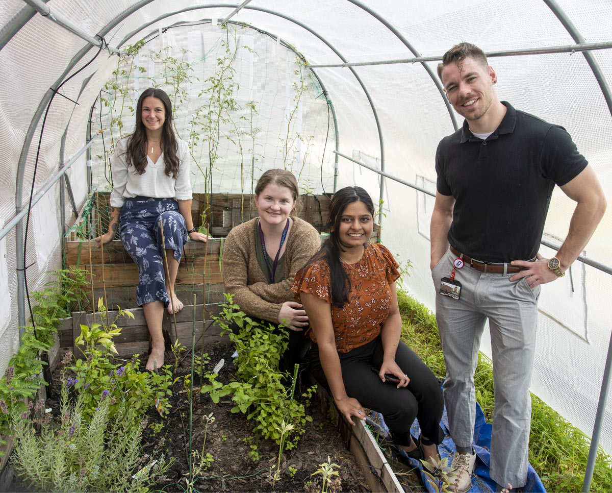 Students pose in the garden