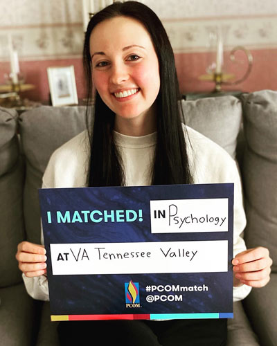 Emily Fannick, MS, PsyD ’24, with her Match Day sign