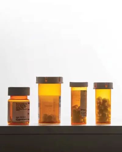 Row of pill bottles on counter top