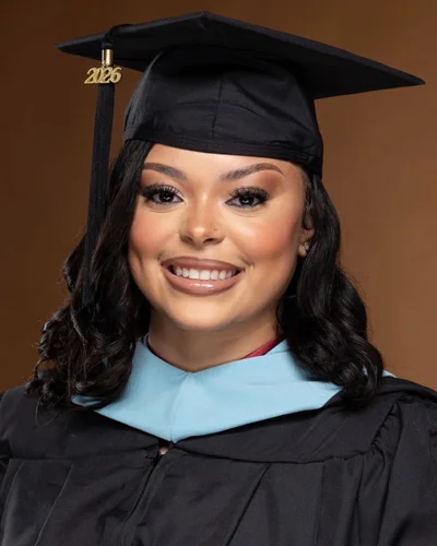Janae Winston, EdS ’26, wears graduate cap and gown