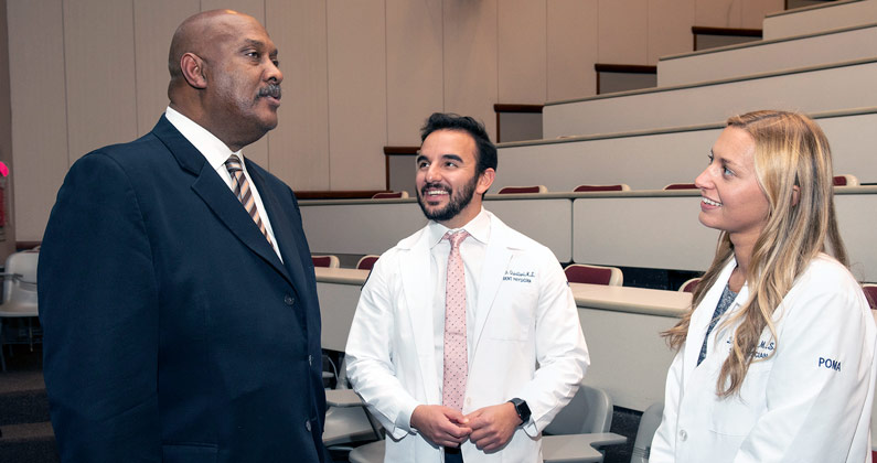 Congressman Dwight Evans (D-PA-03) joined a panel of local physicians and healthcare professionals to discuss shortages in primary care fields with PCOM students. PCOM medical students speak with Congressman Dwight Evans (D-PA-03) in a lecture hall
