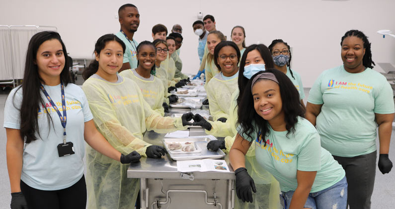 PCOM medical students participating in dissection exercises in lab classroom