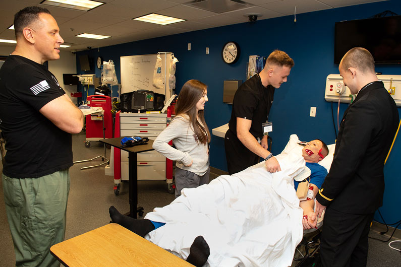 PCOM faculty train medical students on patient simulator