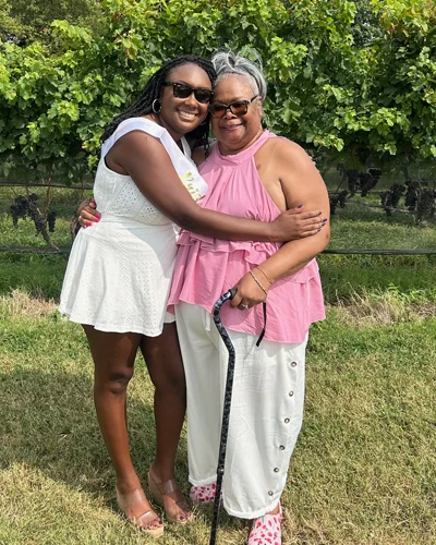 Kenya and Donna Major hug each other