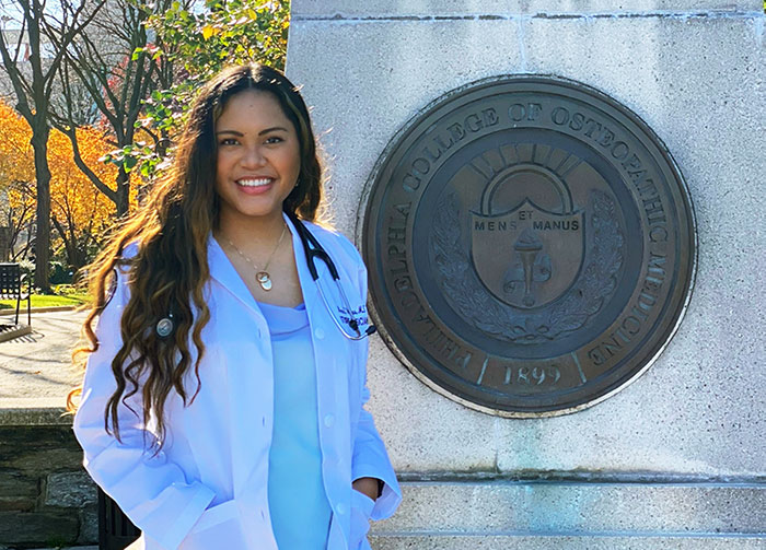Medical student Monica Anne Faye Villegas (DO '24) stands outside at PCOM's Philadelphia campus