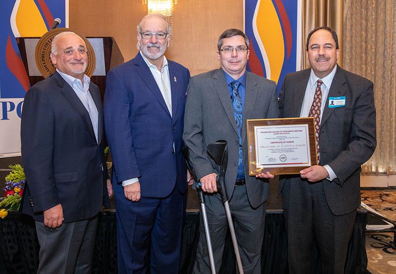Thomas J. Gravina, Jay S. Feldstein, DO '81, Jason Swallow and Paul Lapoint, DO '90 smiling during PCOM's Founders' Day event