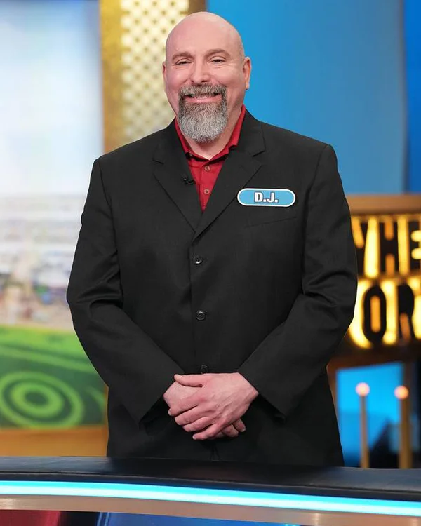 D.J. Csaszar, DO ’05, poses on the set of “Wheel of Fortune”