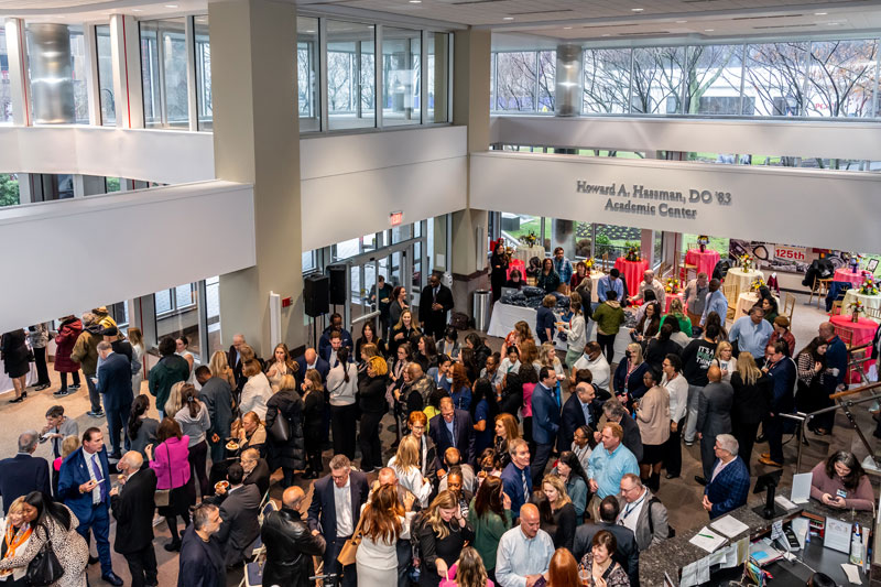 Crowd of people in lobby of Hassman Academic Center