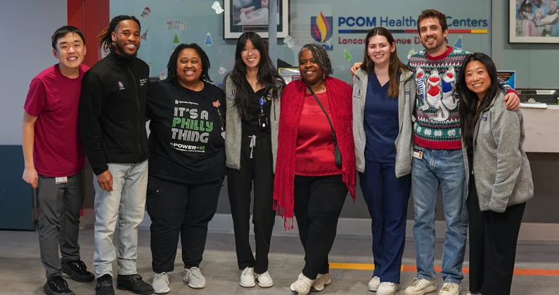 Group of PCOM staff and students participate in a Holiday Giveaway 