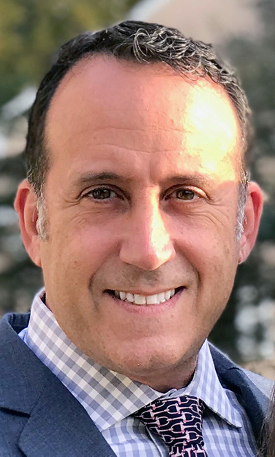 Headshot photograph of PCOM Healthcare Centers operations officer Stephen Castellano, MBA