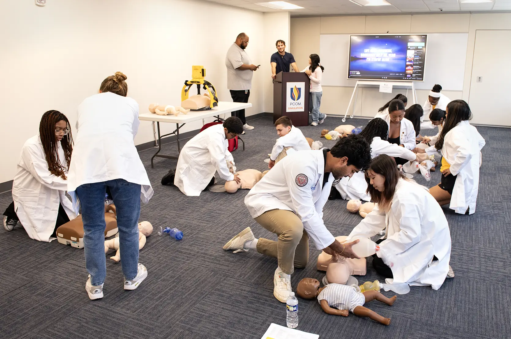 Students in the opportunities academy participate in CPR training.