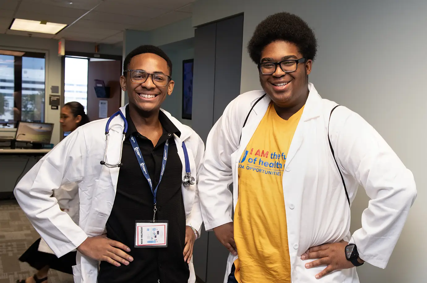 Two male participants in the opportunities academy are shown smiling.