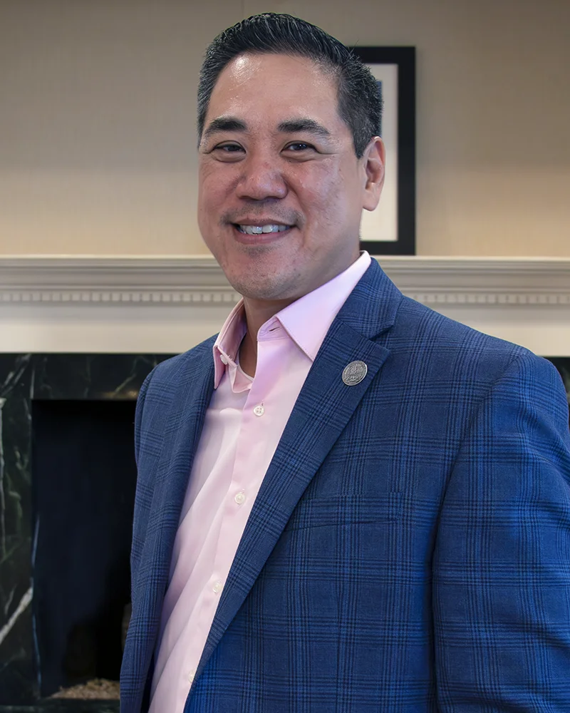 Professional headshot photograph of David Kuo, DO '96, PCOM faculty and Chair of the NBOME Board of Directors