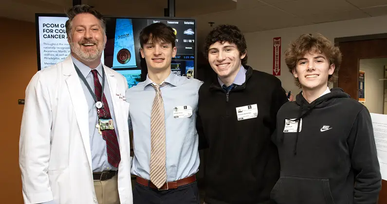 Dr. Peter Bidey and students from Holy Ghost Prep