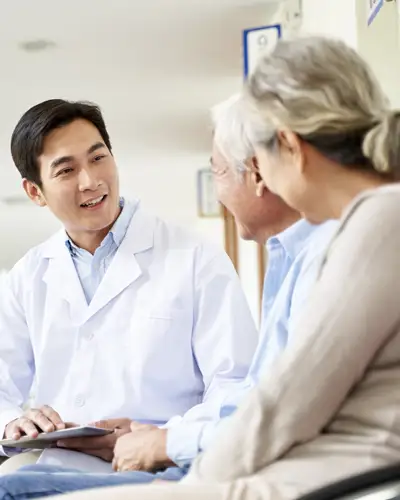 Nursing home admin meets with elderly couple