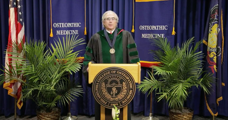 PCOM's Provost Kenneth Veit, DO, addresses the DO Class of 2020 and their families from a podium during the medical school's virtual graduation ceremony.