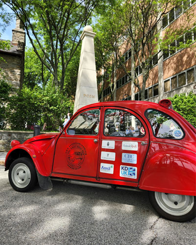 Kennedy’s Disease Association’s (KDA) Citroen 2CV sits infront of PCOM Philadelphia campus