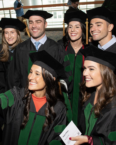 Group of PCOM graduate pose for a selfie